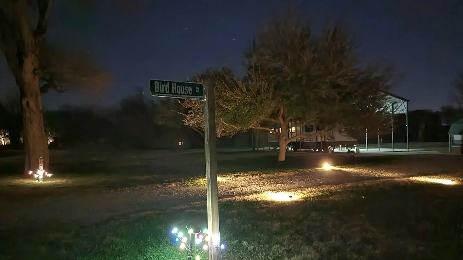 The entrance to Bird House Ct. is well lit at night.