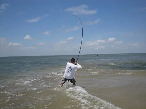 Image of fisherman, fishing in the surf of San Luis Pass.