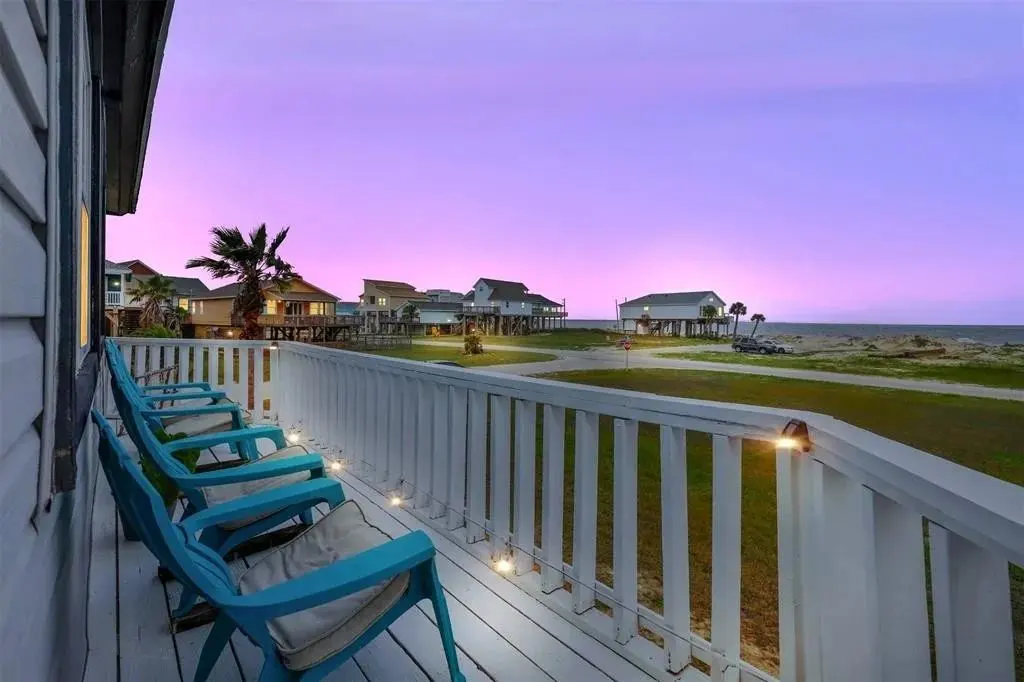 The Adirondack chairs on the deck of Sea La Vie, facing the sunrise.